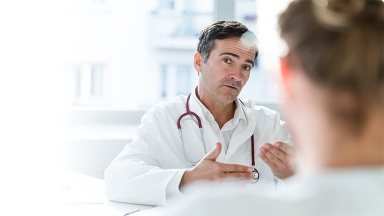 A doctor counselling a patient.